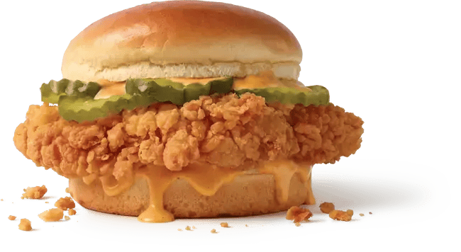 A Jack in the Box Cluck Chicken Sandwich with pickles and sauce.