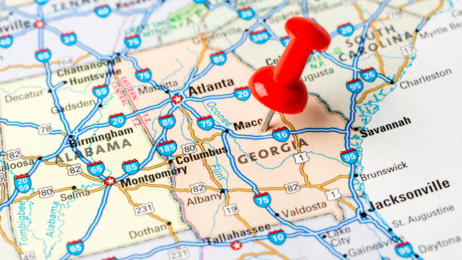 A map showing the state of Georgia with a push pin it.