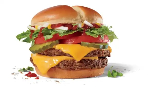 Double Jack Burger with lettuce, cheese, tomato, pickles, mustard, ketchup and onions.